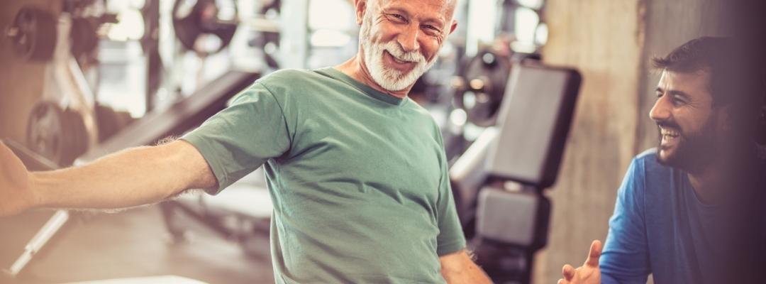 Elderly man exercising in the gym