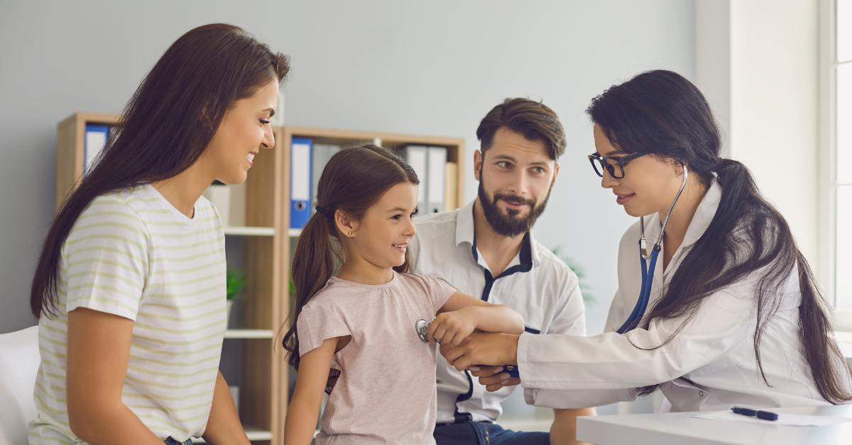 Doctors with mom and girl.